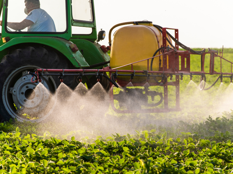 tractor spraying field
